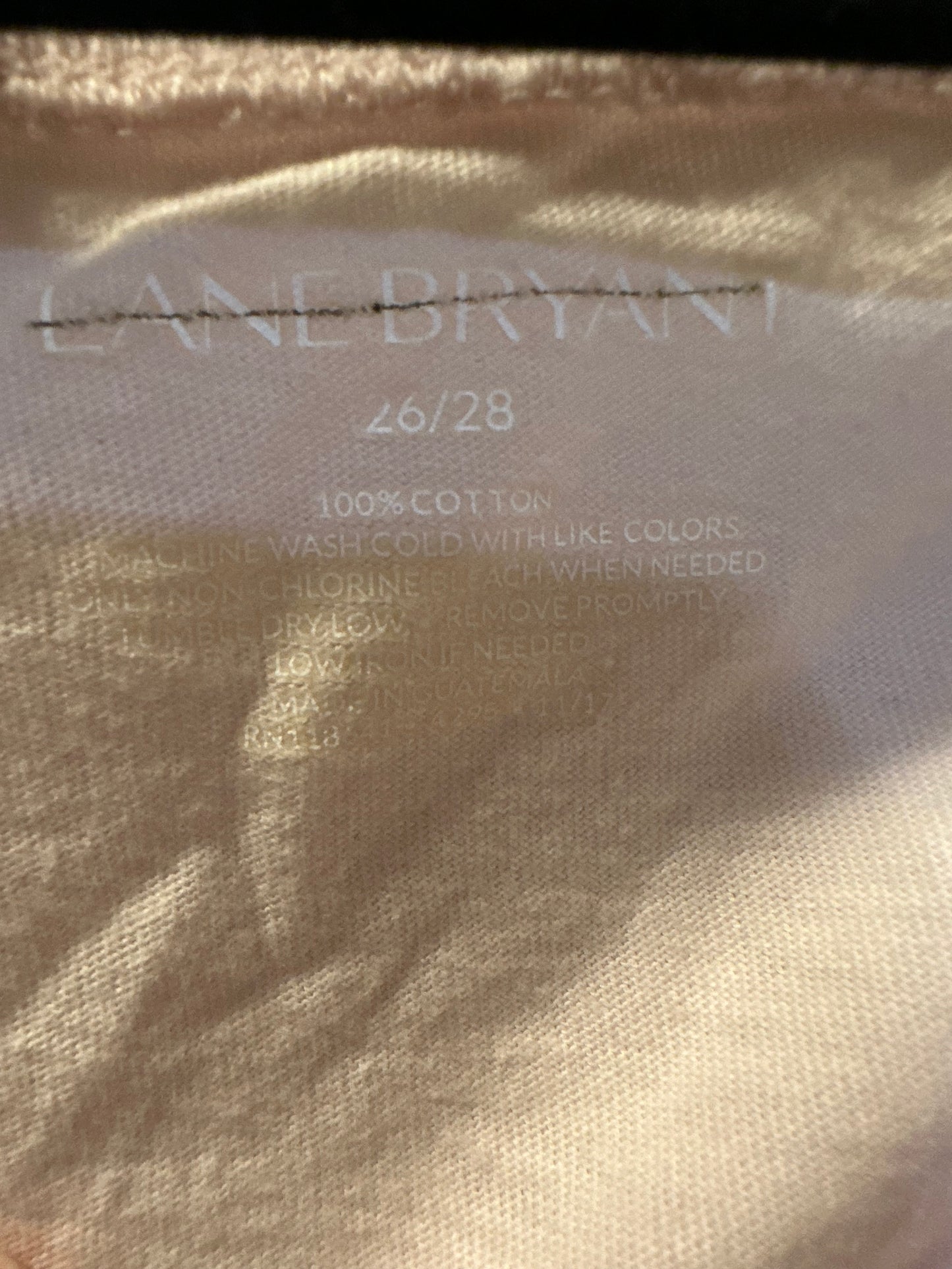 Size 4x/5x (26/28) Lane Bryant pink knit long-sleeve top featuring a ruffle yoke design.