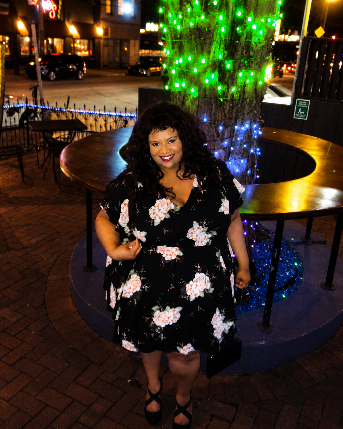 Size 4x (26) Torrid black floral smocked georgette dress with a v-neck and tiered skirt.
