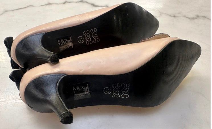 I Heart beige chihuahua puppy themed kitten heels featuring a dog face applique on the toe and black bows on the back.