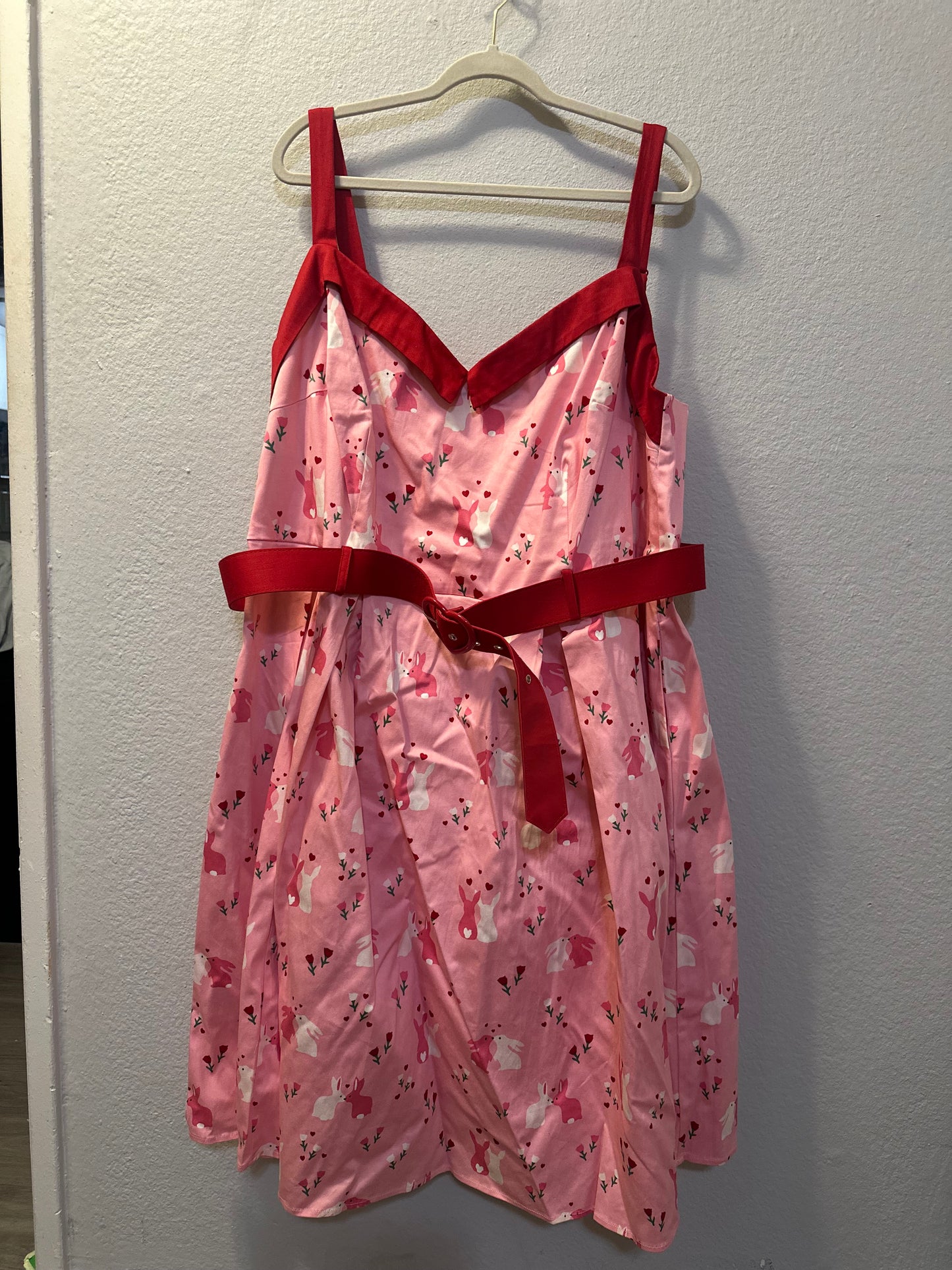 Size 4x (26) Collectif Nova Some Bunny To Love Dress featuring a pastel pink bunny and floral print.