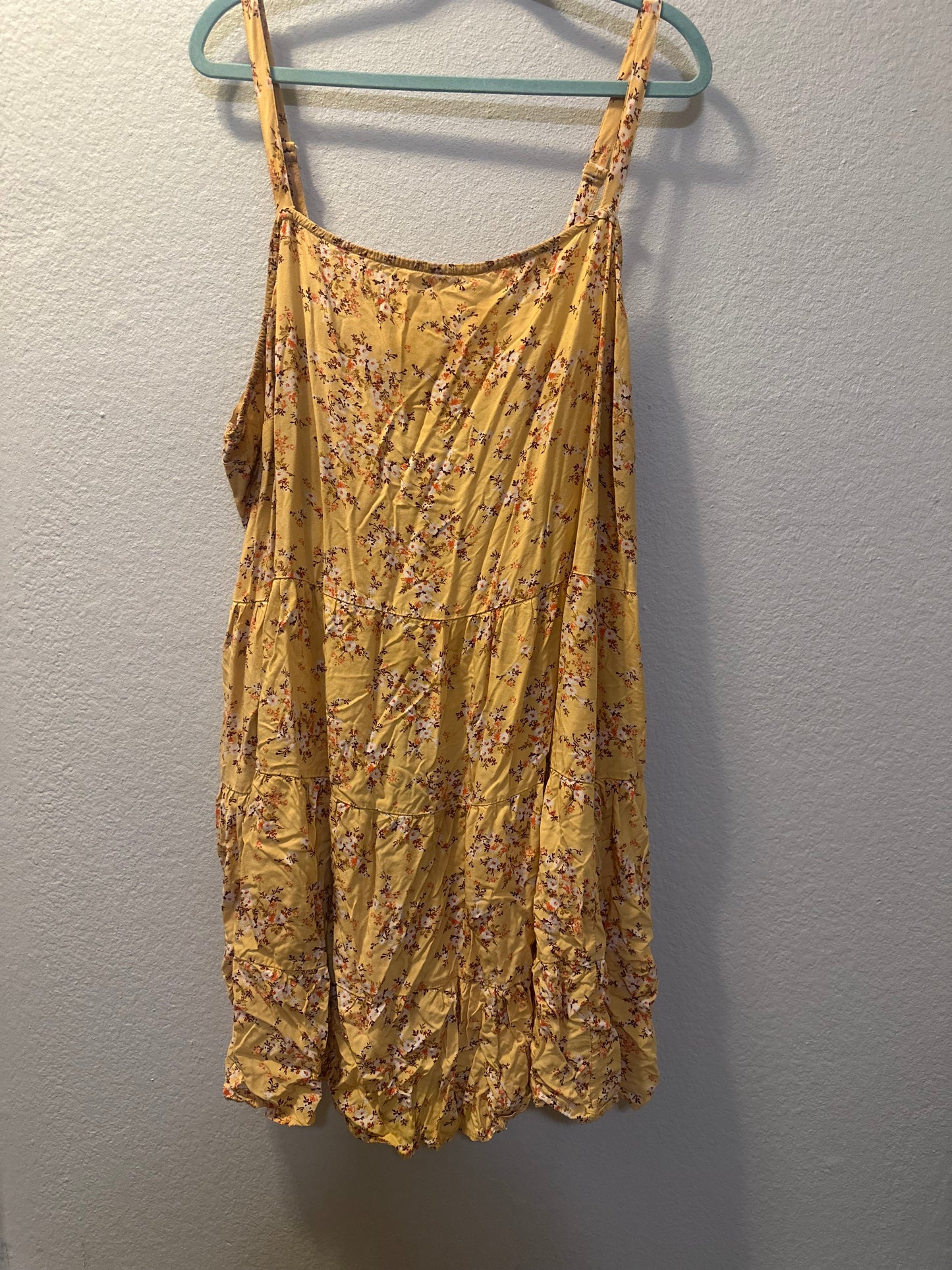 Size 4x (30) Old Navy yellow floral cami swing dress with adjustable straps and a tiered skirt.