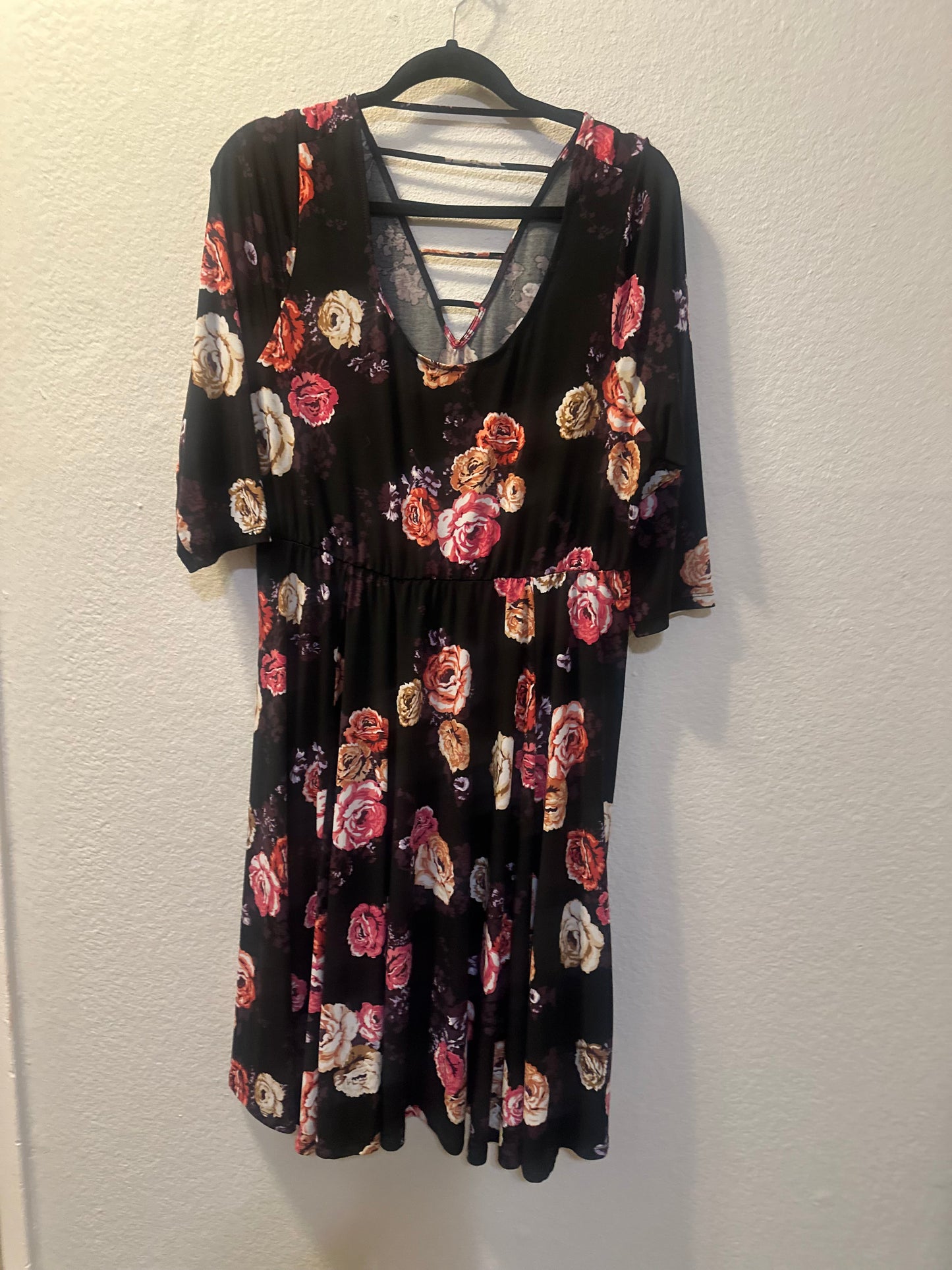 Size 2x (22) Torrid 3/4 sleeve dress in torrid studio knit in black with floral pattern.