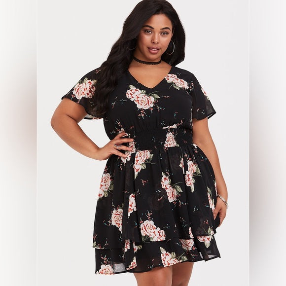 Size 4x (26) Torrid black floral smocked georgette dress with a v-neck and tiered skirt.