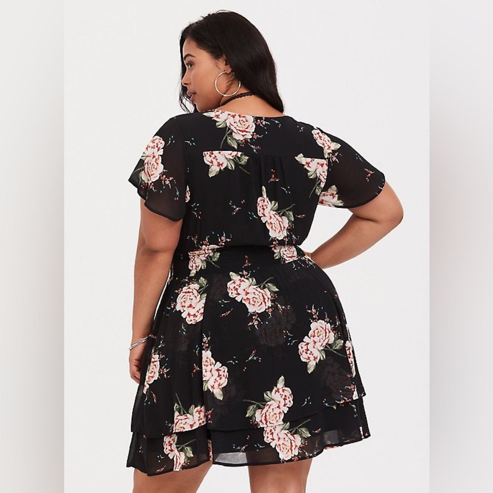 Size 4x (26) Torrid black floral smocked georgette dress with a v-neck and tiered skirt.