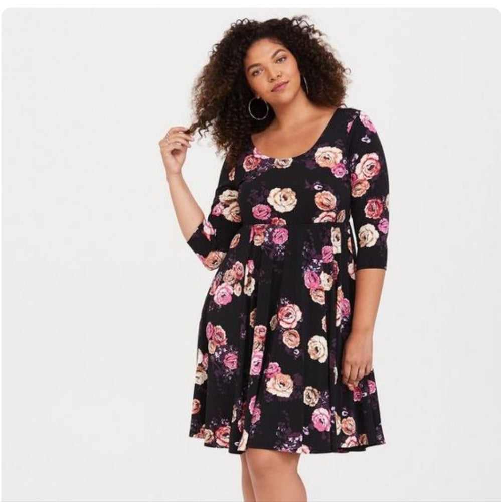 Size 2x (22) Torrid 3/4 sleeve dress in torrid studio knit in black with floral pattern.