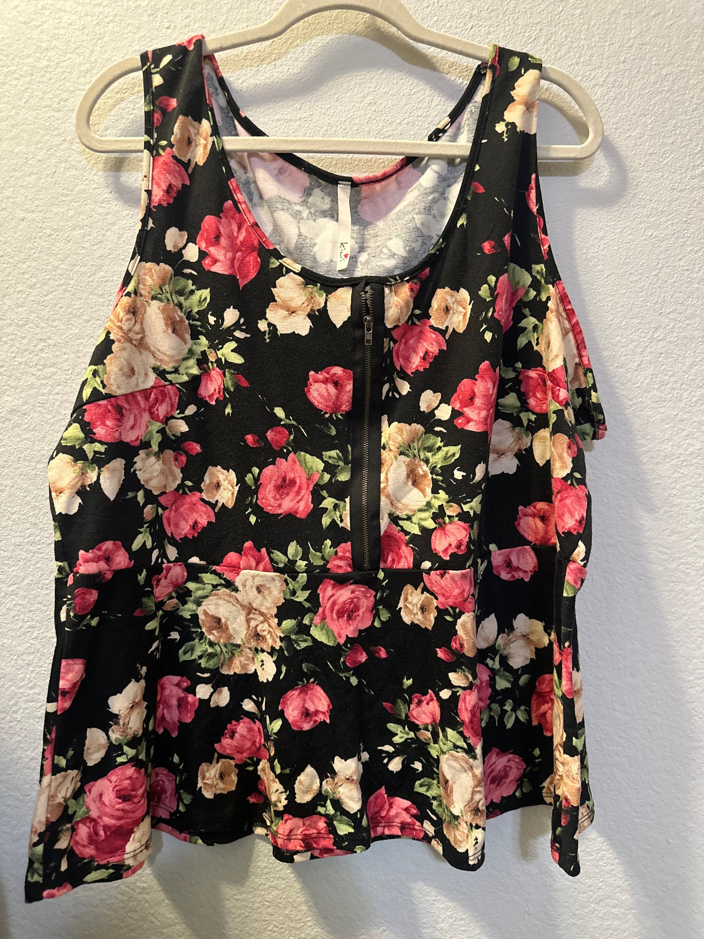 Size 3x (24) black, and floral peplum top with zipper detail
